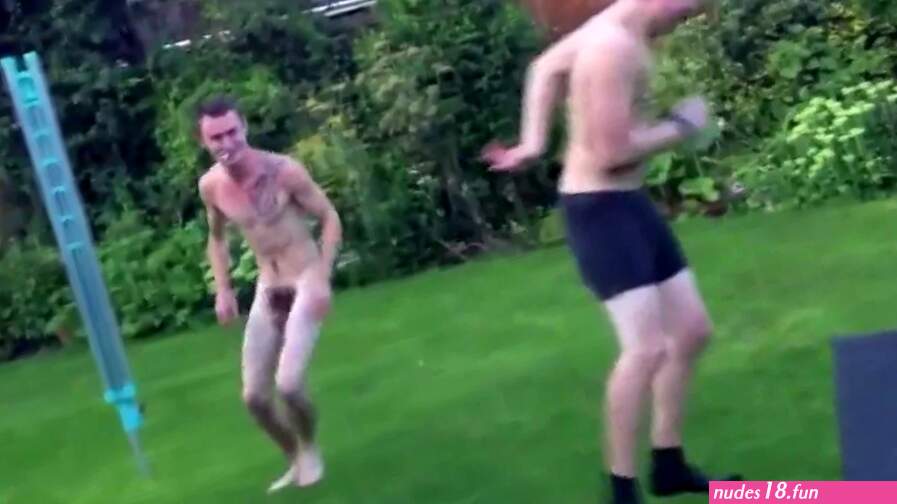 Two nude friends funny fighting in the garden