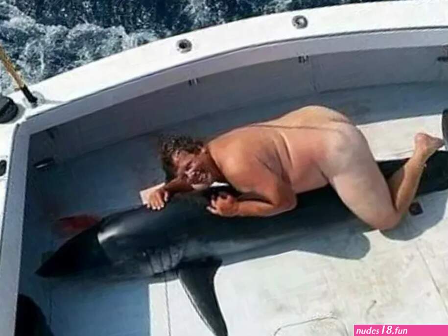 Who Is the Naked Man in the Mystery Shark Picture?