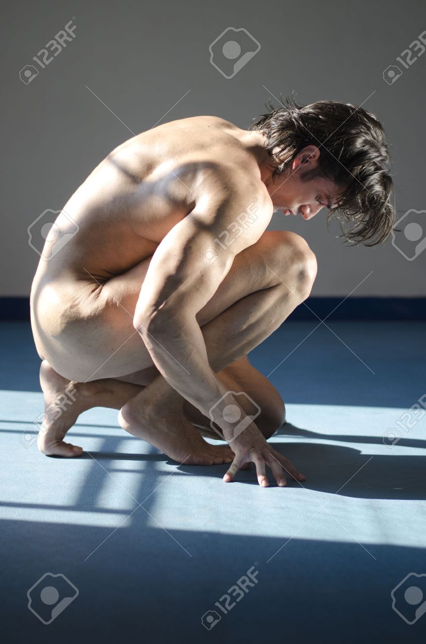 Handsome Muscular Man Totally Naked Kneeling On The Floor In Studio Shot. Looking Down Stock Photo Picture and Royalty Free Image. Image 26483850.