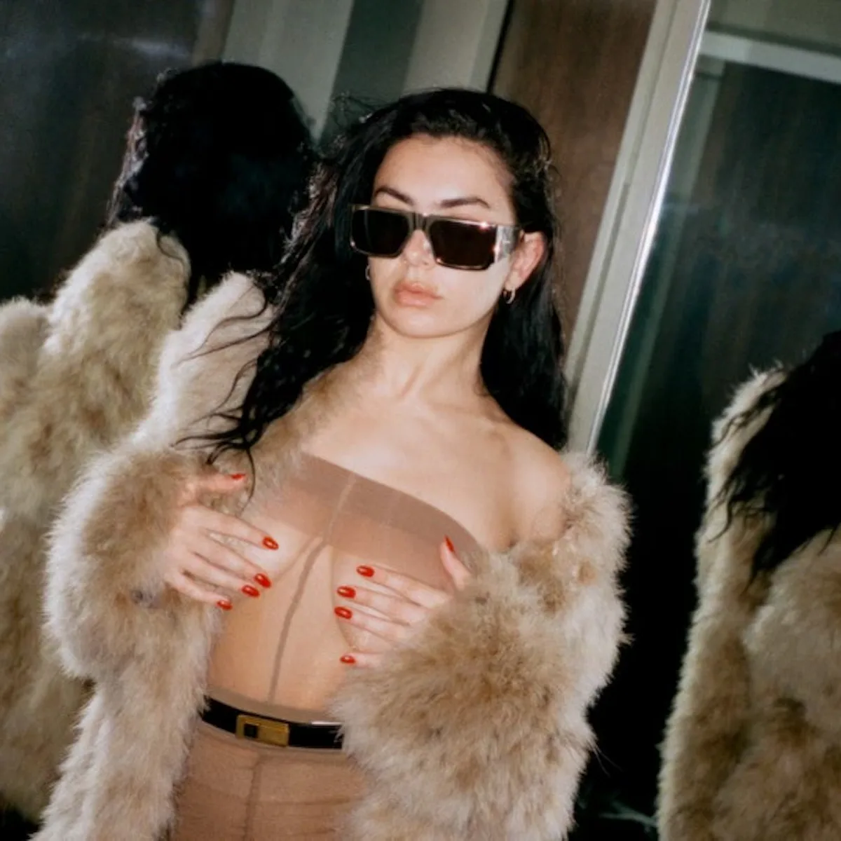 Charli XCX Frees the Nipple In a Nude Lingerie Dress For Sweat Tour