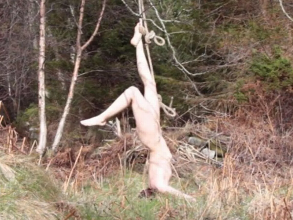 Naked artist left hanging upside-down from tree after bizarre film scene goes embarrassingly wrong