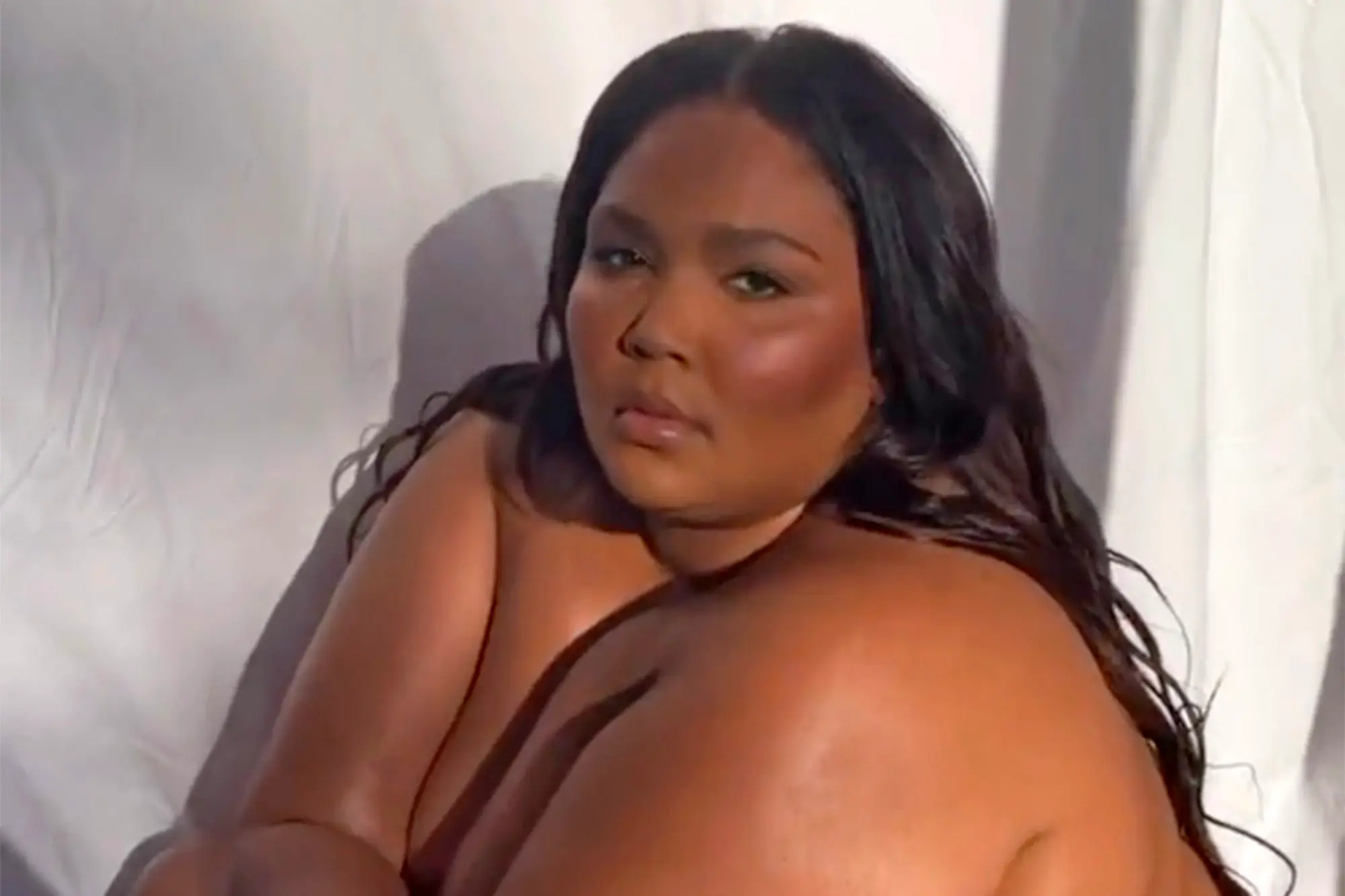 Lizzo goes nude while teasing new song about self-love