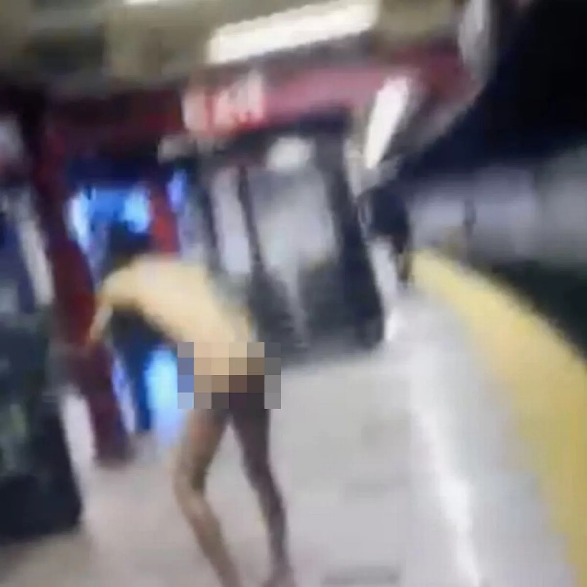 Naked man electrocuted after pushing train passenger onto rails in shocking footage