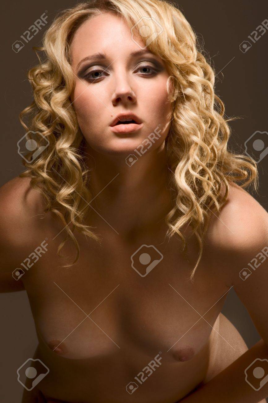 Nude Beautiful Blond With Curly Hair And Developed Firm Breast Standing And Bending Forward Stock Photo Picture and Royalty Free Image. Image 5257479.