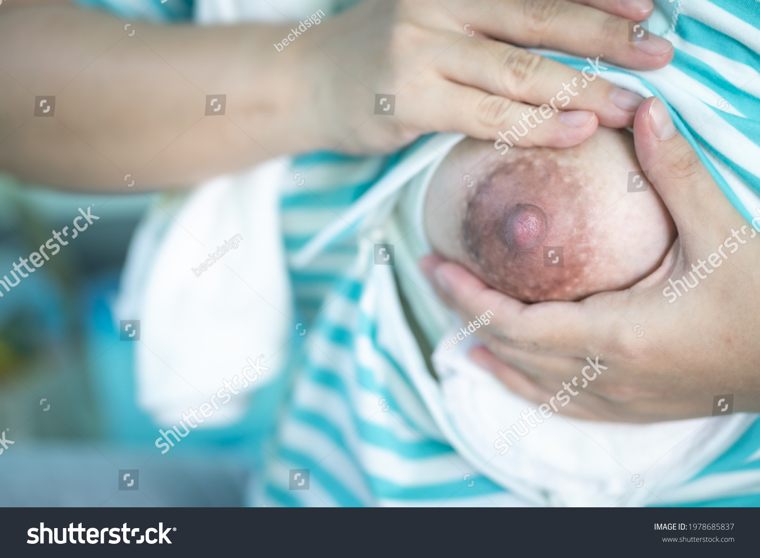 Close-up Mother Squeezing Milk Out Her Stock Photo 1978685837
