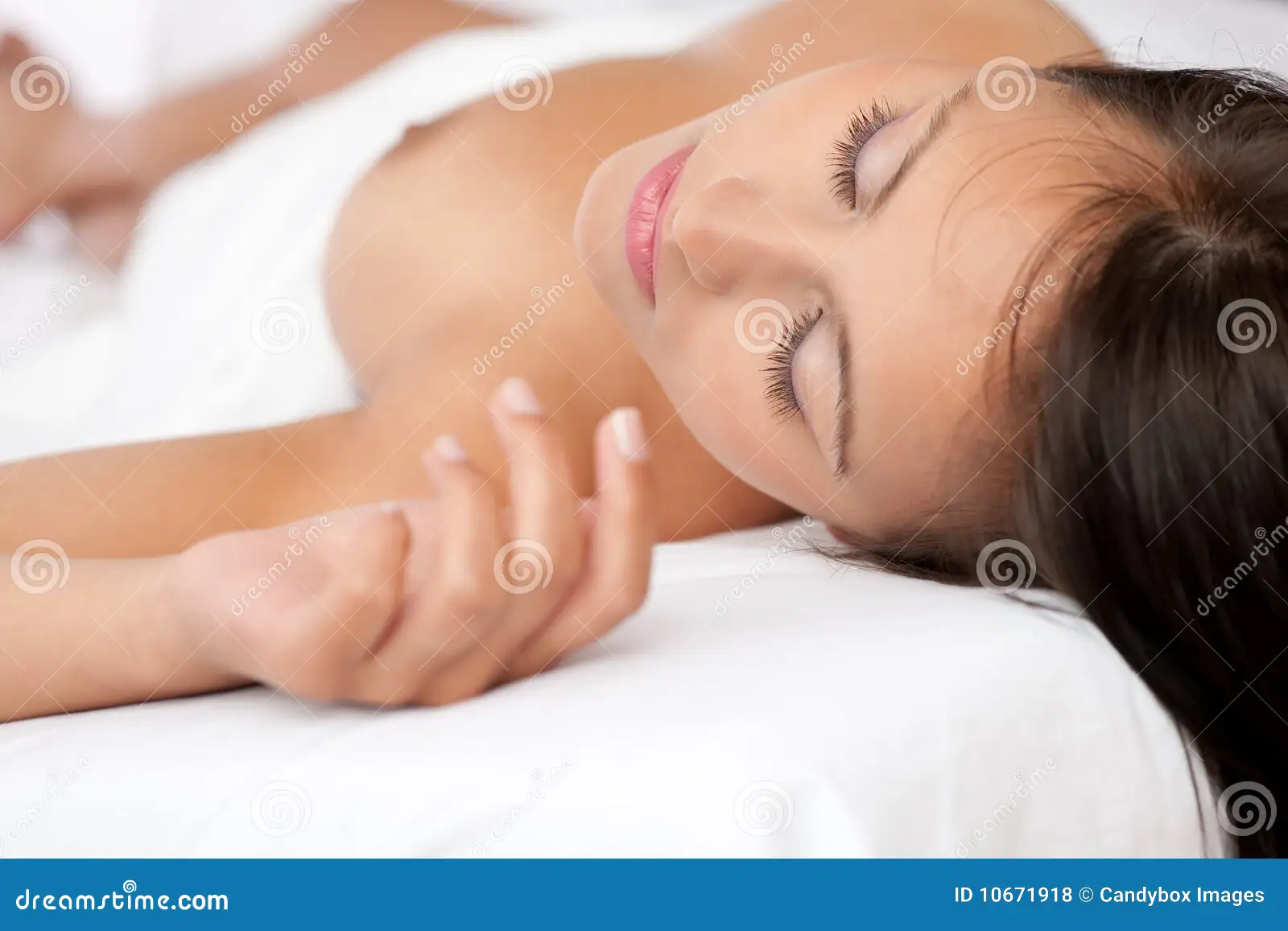Beautiful Naked Woman Sleeping in White Bed Stock Photo