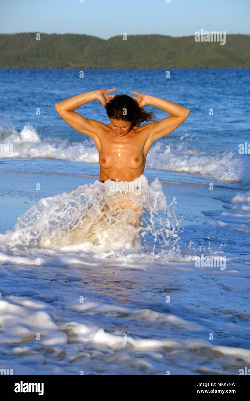 young nude woman atthe beach