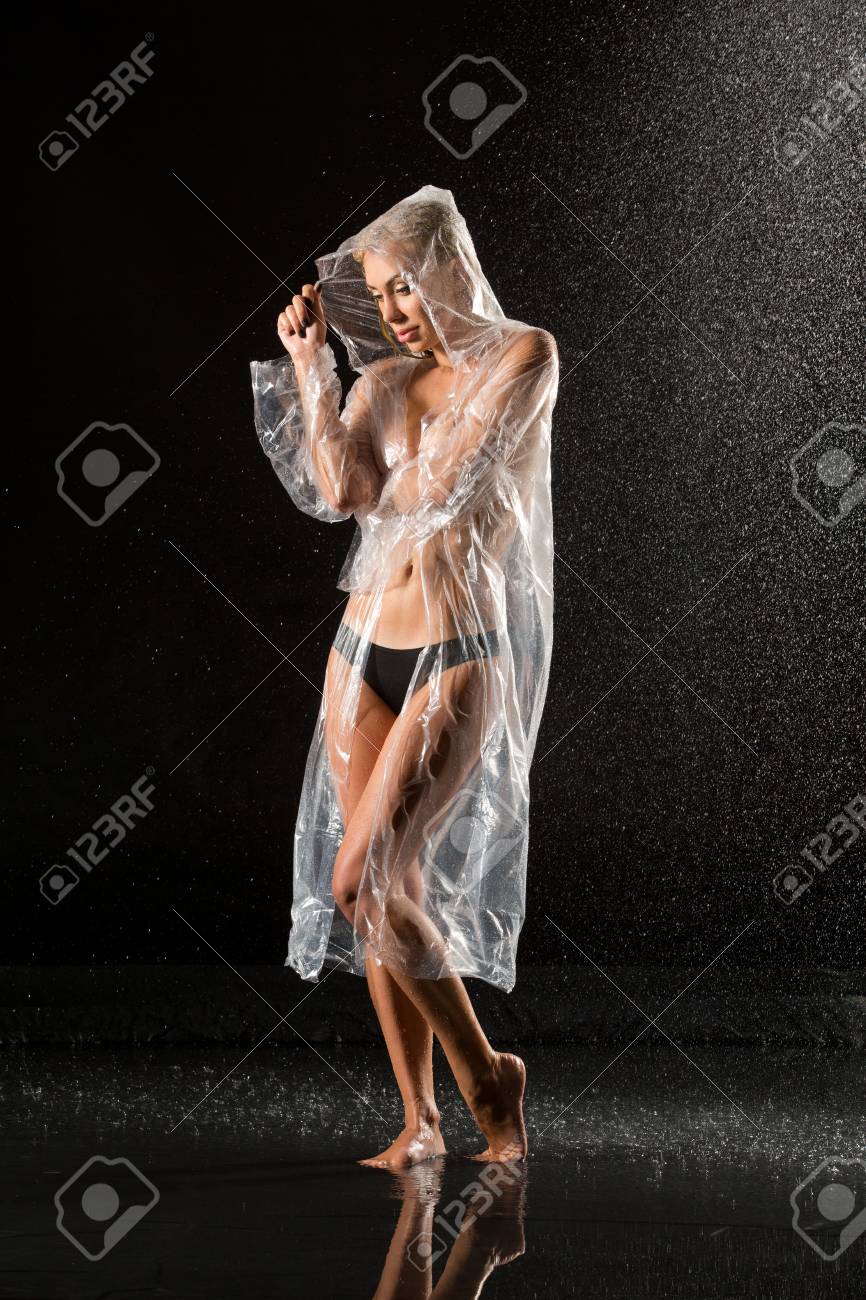 Nuded Woman In Raincoat Standing In The Rain. Black Background. Photographie Retouchee Stock Photo Picture and Royalty Free Image. Image 94682259.