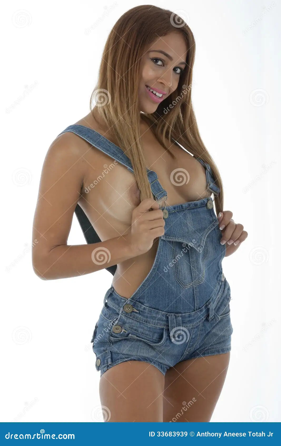 Sexy Vrouw in Slechts Denimoverall Stock Afbeelding