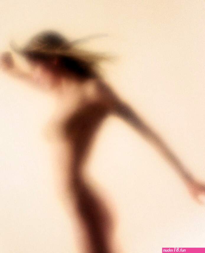 Young nude woman with wind-blown hair